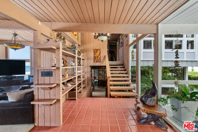 a bathroom with a granite countertop sink and a shower curtain