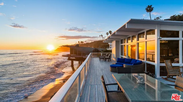 a view of a balcony with chairs