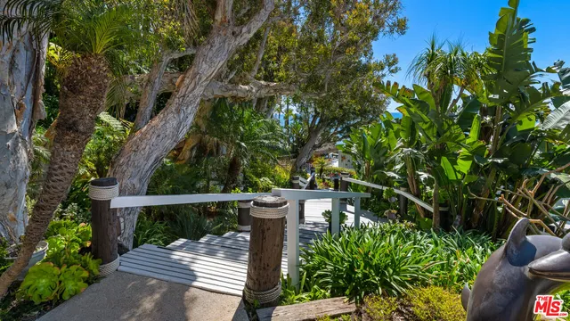 a wooden fence with trees in the background