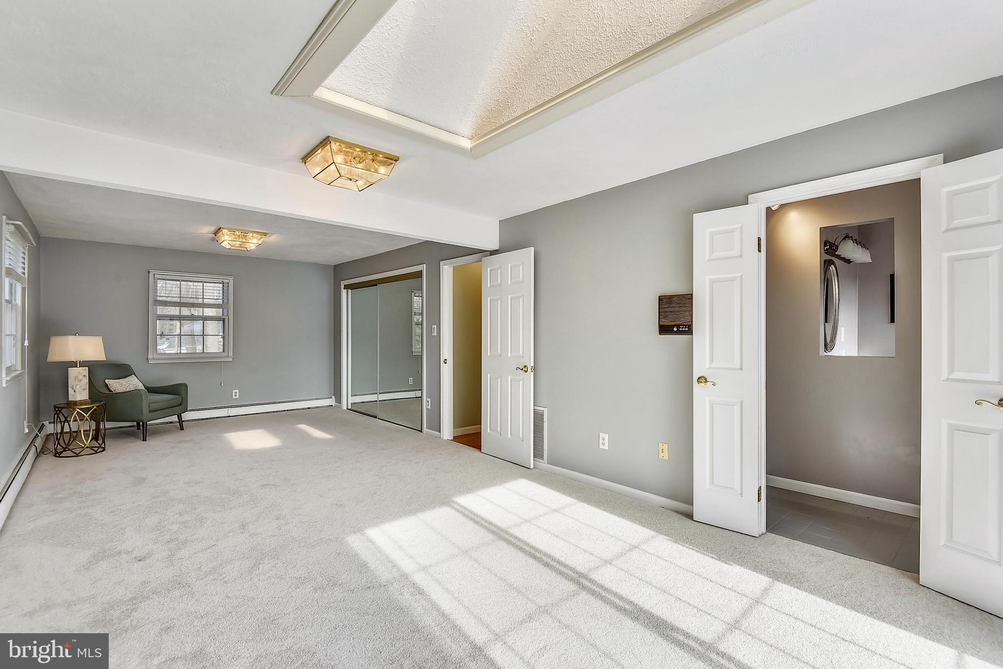 9925 Coach Road Vienna, VA 22181 - Photo 15 of 45 Primary Bedroom with skylight