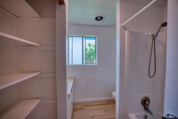a bathroom with a shower and a tub