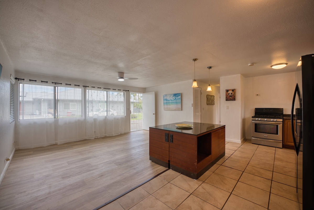 2059 Kinoole Street Hilo, HI 96720 - Photo 20 of 30 a kitchen with stainless steel appliances granite countertop a stove and a refrigerator