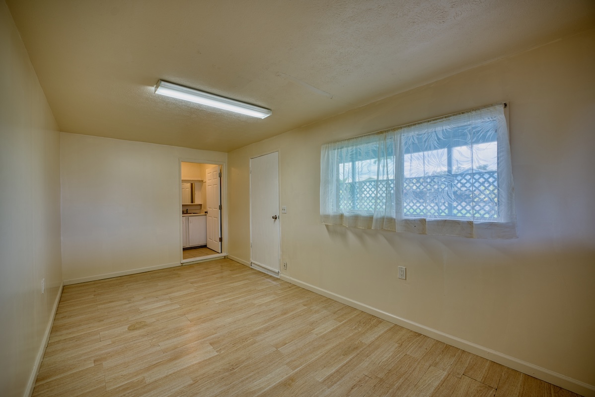 2059 Kinoole Street Hilo, HI 96720 - Photo 21 of 30 an empty room with windows