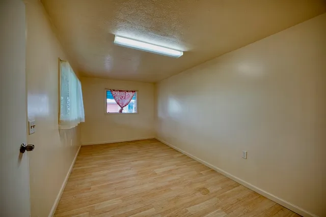 a view of an empty room and window