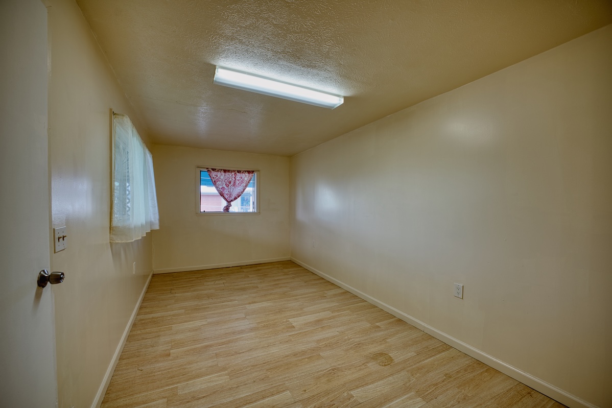 2059 Kinoole Street Hilo, HI 96720 - Photo 22 of 30 a view of an empty room and window