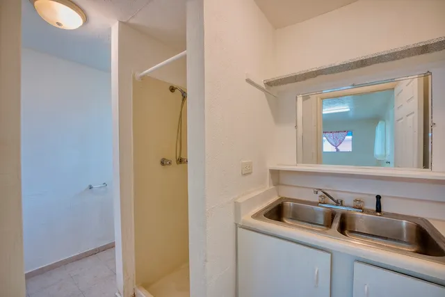 a bathroom with a sink and mirror