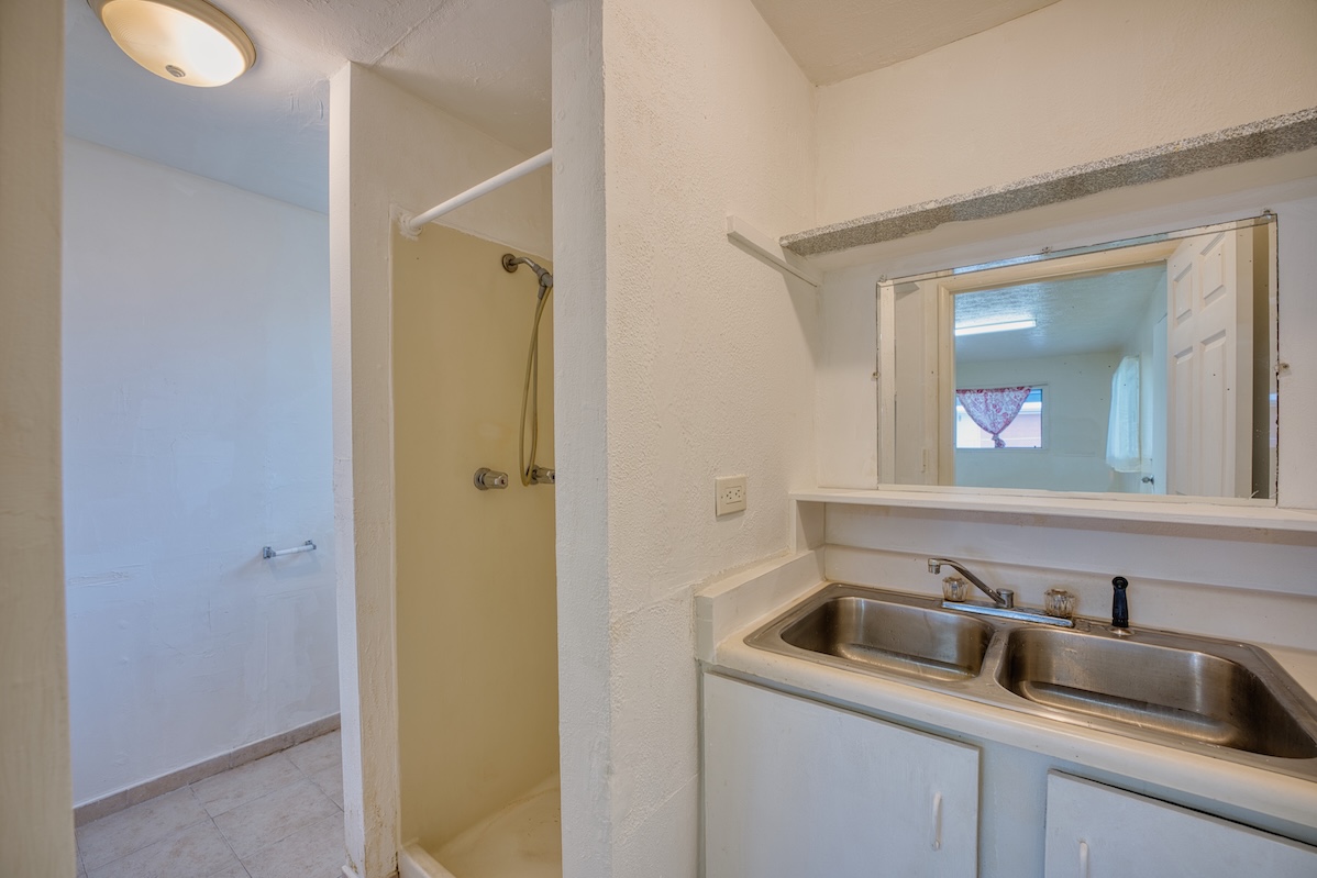 2059 Kinoole Street Hilo, HI 96720 - Photo 24 of 30 a bathroom with a sink and mirror