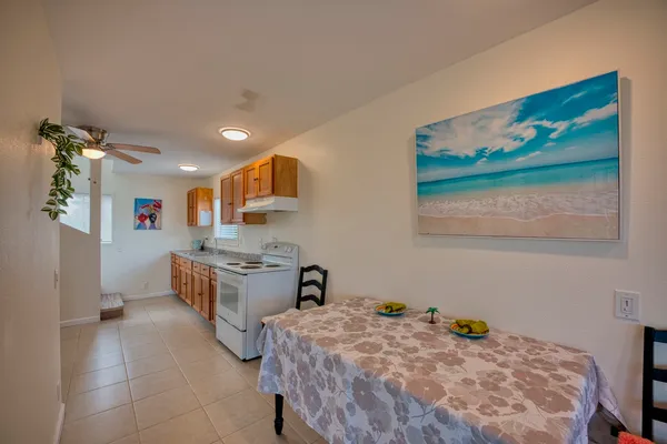 a kitchen that has a lot of cabinets in it