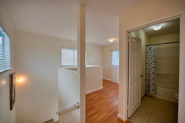 a bathroom with a shower and a glass door