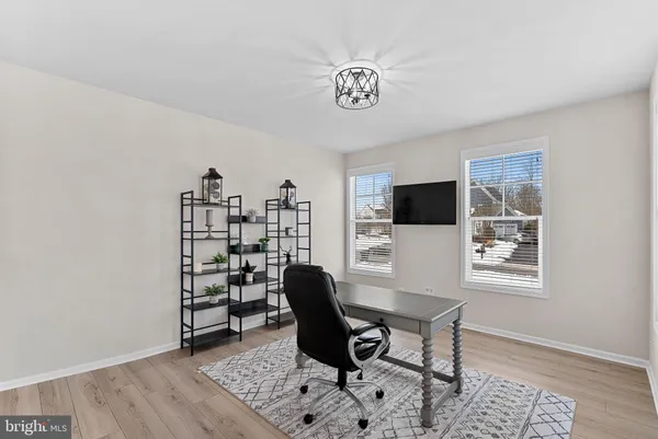 a living room with furniture windows and a fireplace