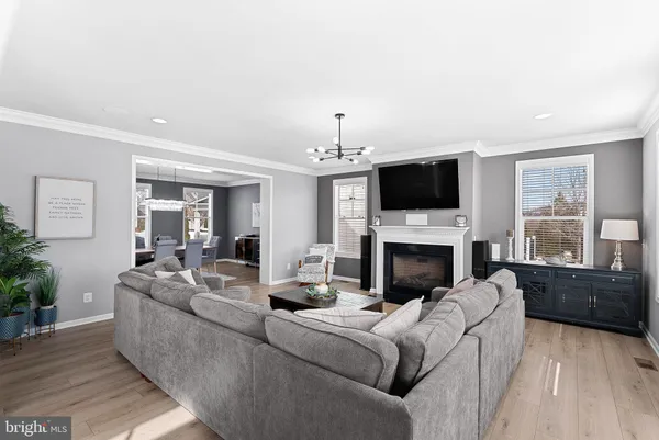 a large kitchen with stainless steel appliances kitchen island granite countertop a large island in the center