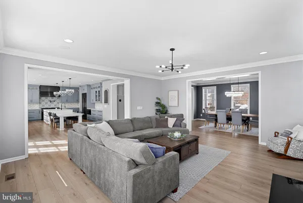 a large kitchen with a table and chairs in it