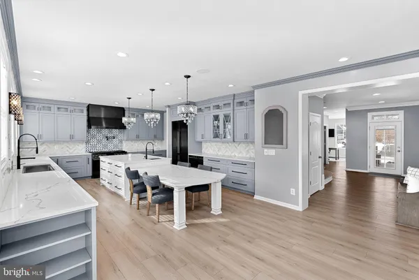 a kitchen with stainless steel appliances a refrigerator and a cabinets