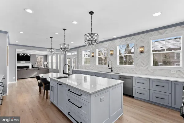 a bathroom with a sink and a large mirror
