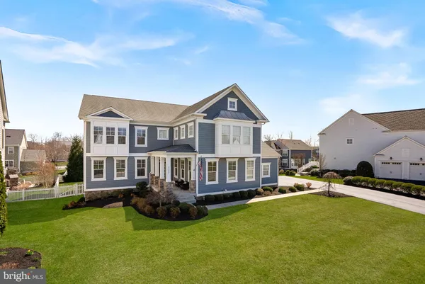 a view of a house with a yard patio and sitting area