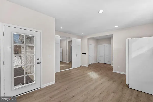 a spacious bathroom with a granite countertop sink a mirror and a