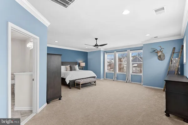 a bathroom with a granite countertop sink a toilet and a mirror