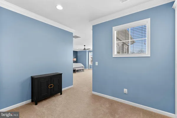 a room with furniture pool table and flat screen tv