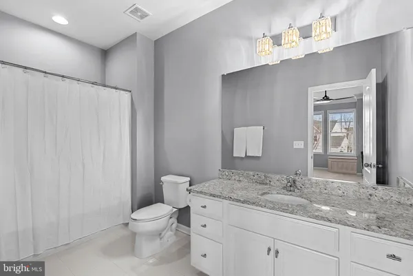 a view of a patio with table and chairs potted plants with large tree
