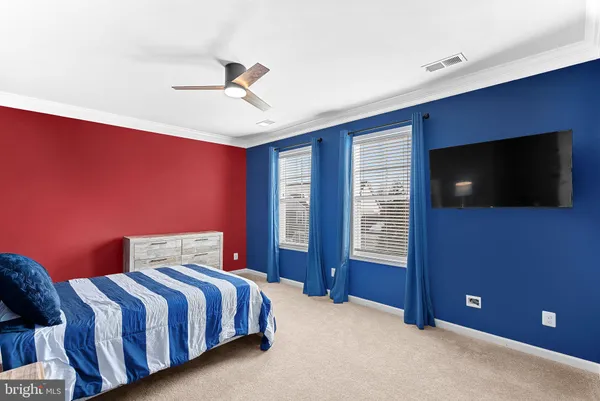 a roof deck with table and chairs