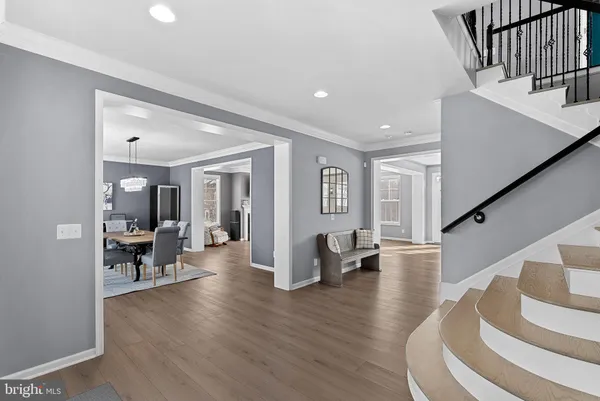 a view of entryway and hall with wooden floor