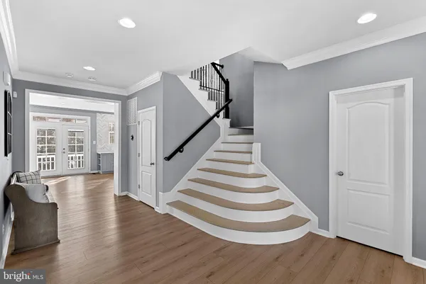 a living room with fireplace furniture and a wooden floor