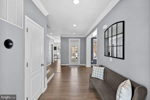 a view of a livingroom with furniture window and wooden floor
