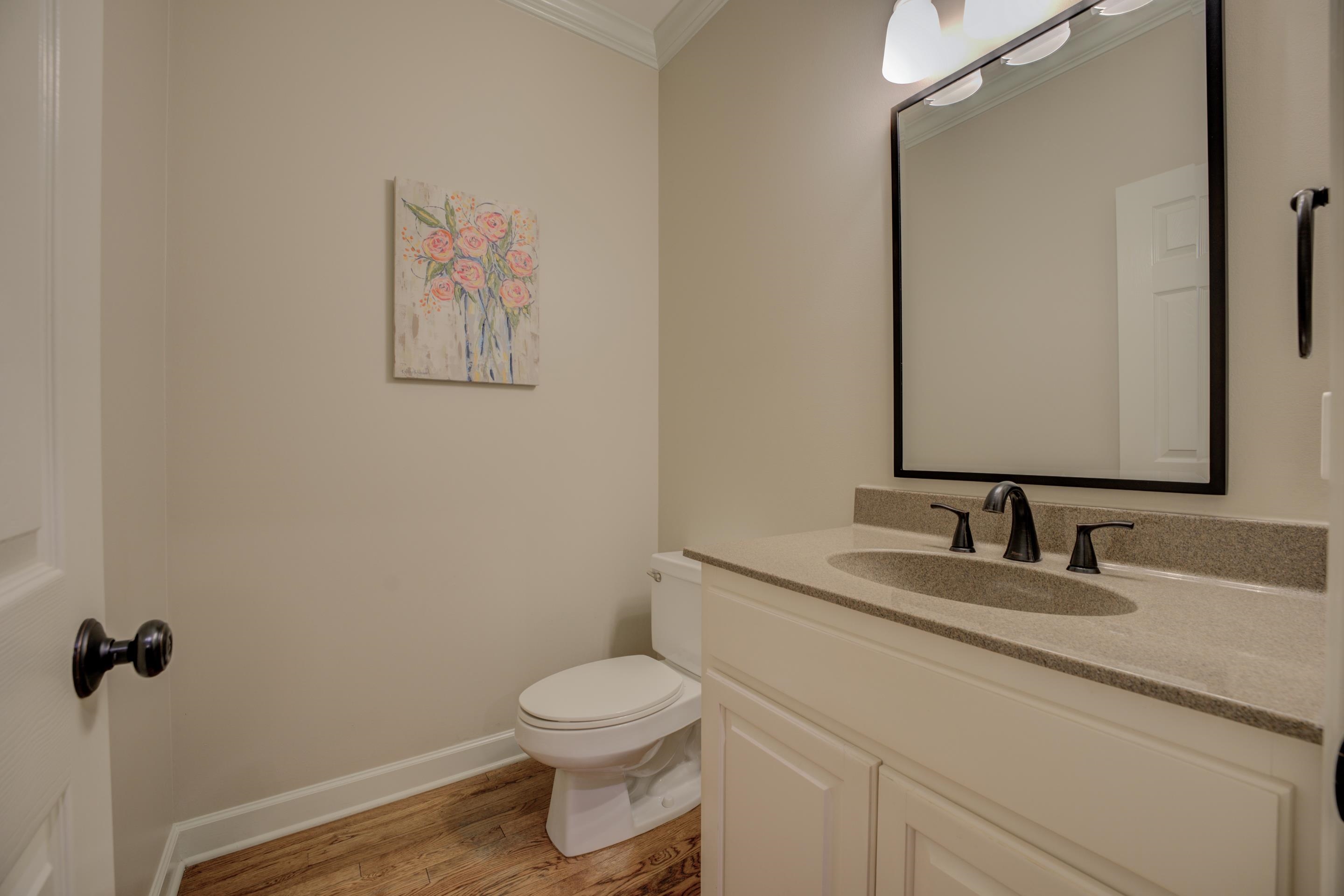9852 Garden Place Collierville, TN 38139 - Photo 25 of 38 a bathroom with a granite countertop sink mirror vanity and toilet