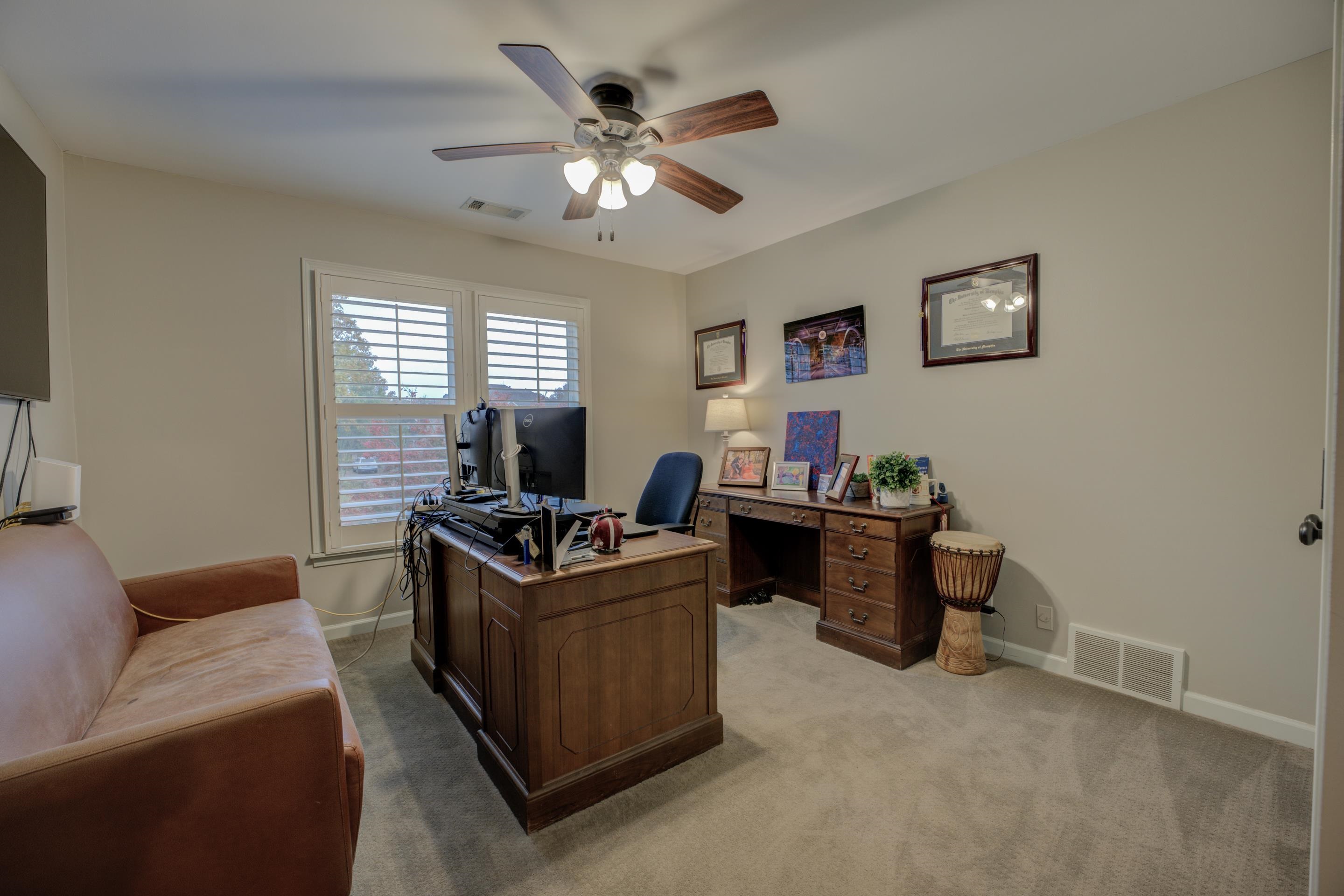 9852 Garden Place Collierville, TN 38139 - Photo 29 of 38 a living room with furniture and a chandelier