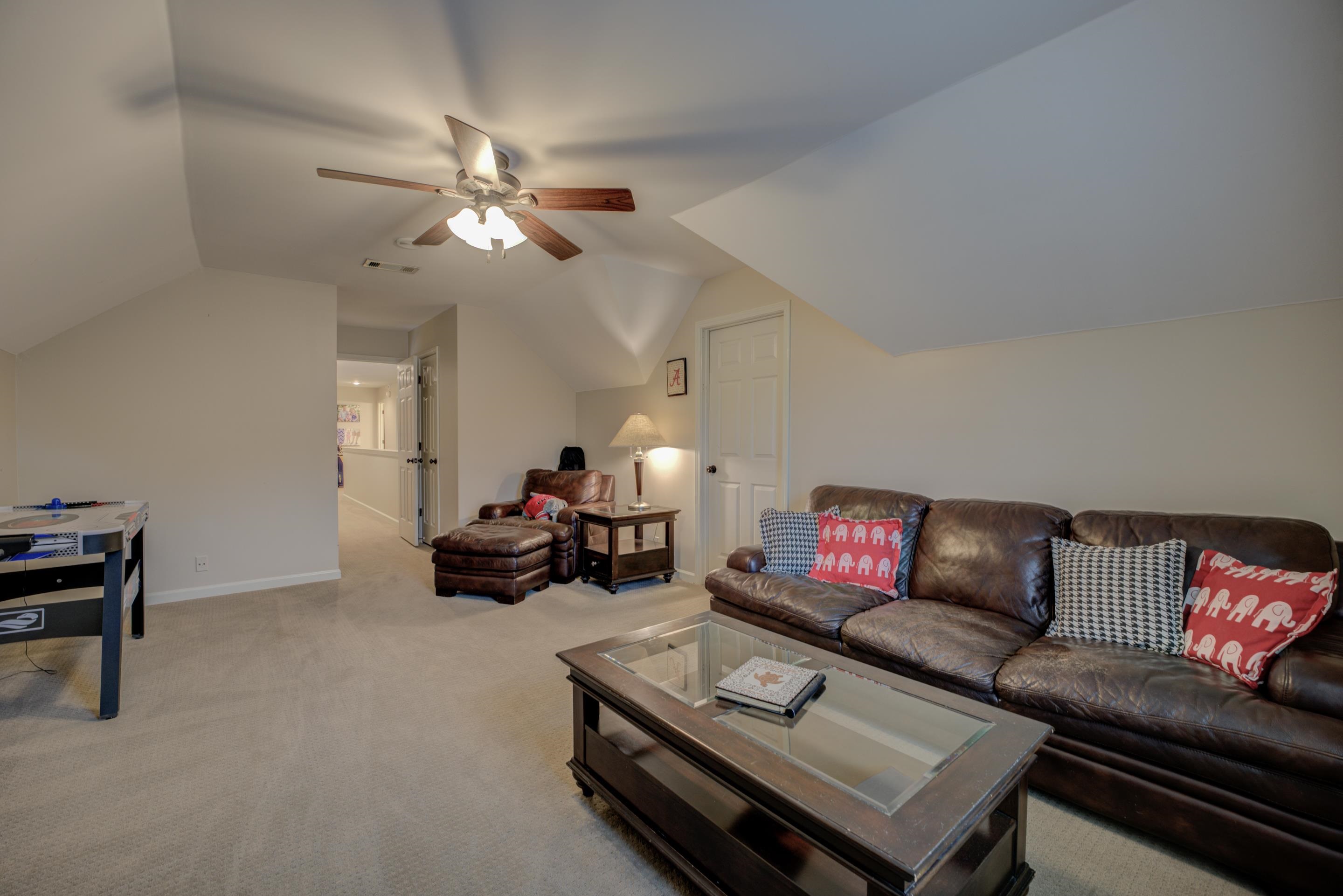 9852 Garden Place Collierville, TN 38139 - Photo 31 of 38 a living room with furniture a rug and a lamp