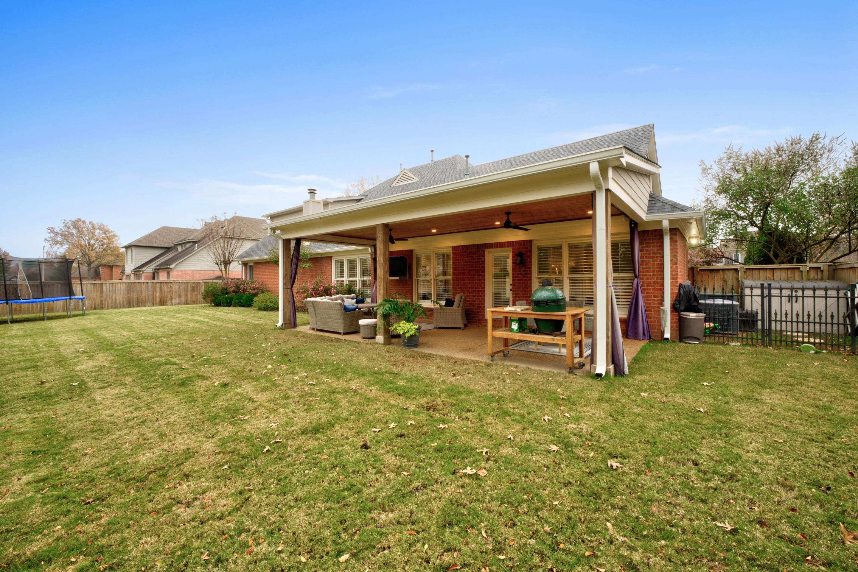 9852 Garden Place Collierville, TN 38139 - Photo 33 of 38 a view of a house with backyard porch and furniture