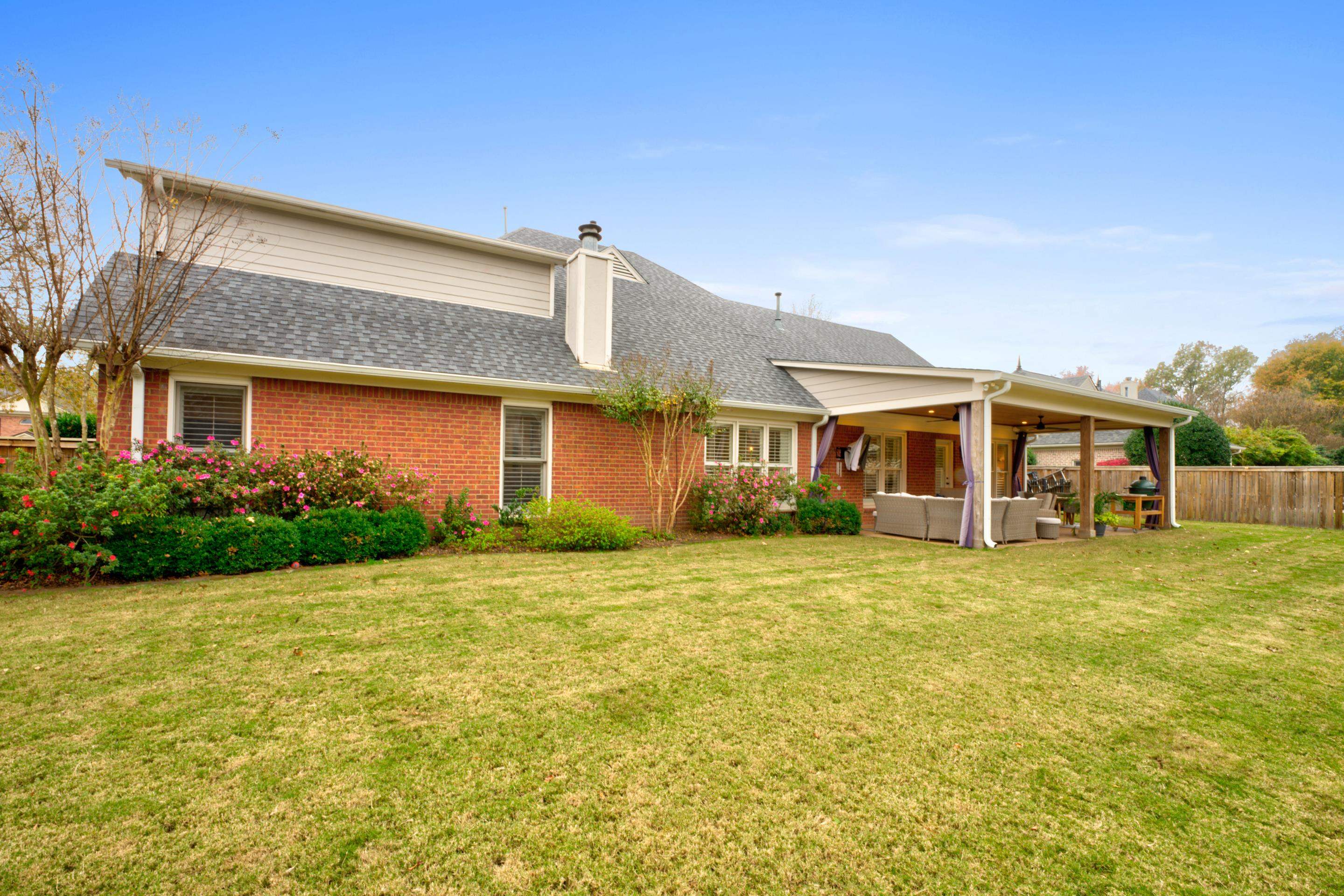 9852 Garden Place Collierville, TN 38139 - Photo 34 of 38 a front view of a house with a garden