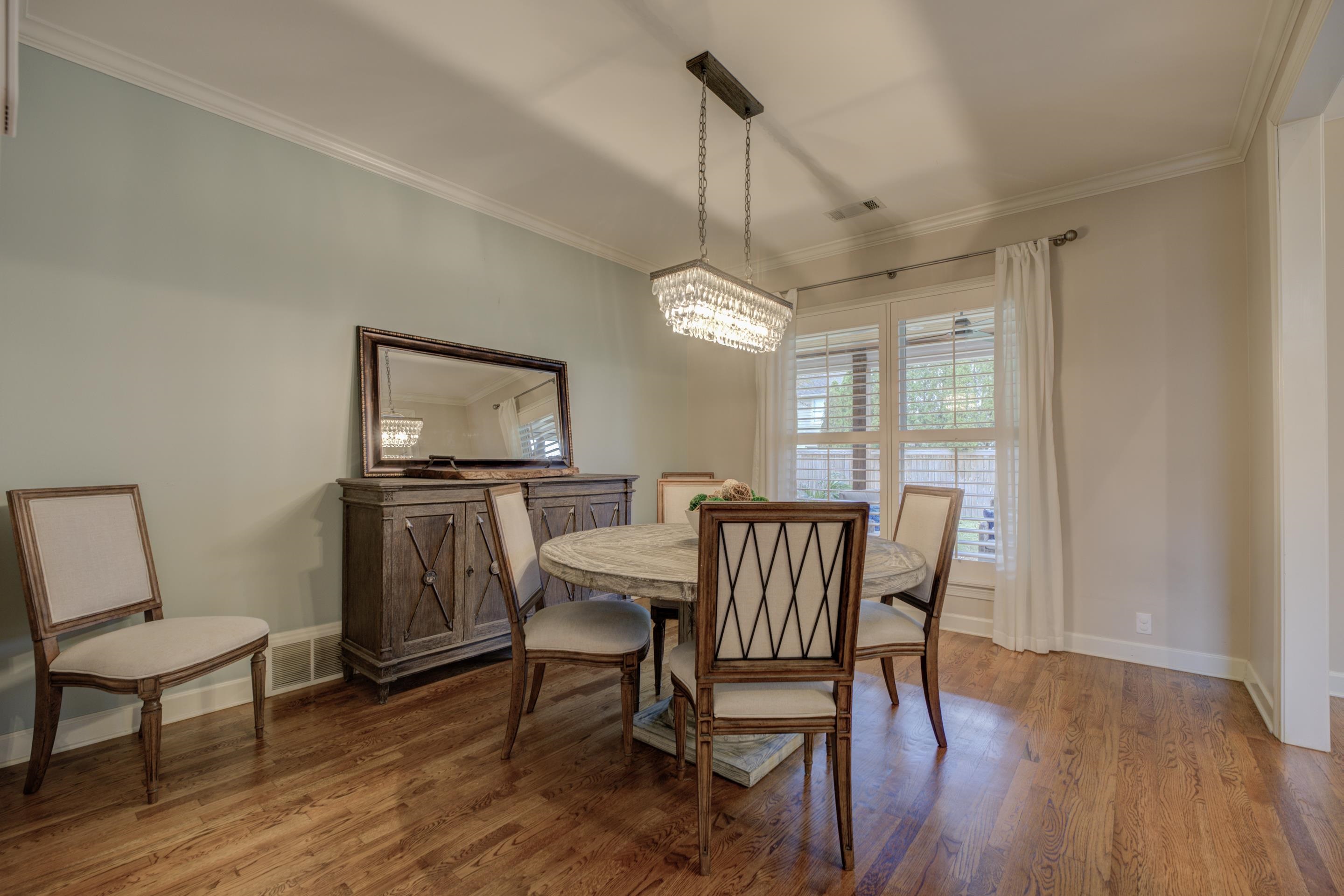 9852 Garden Place Collierville, TN 38139 - Photo 7 of 38 a view of a dining room with furniture window and wooden floor