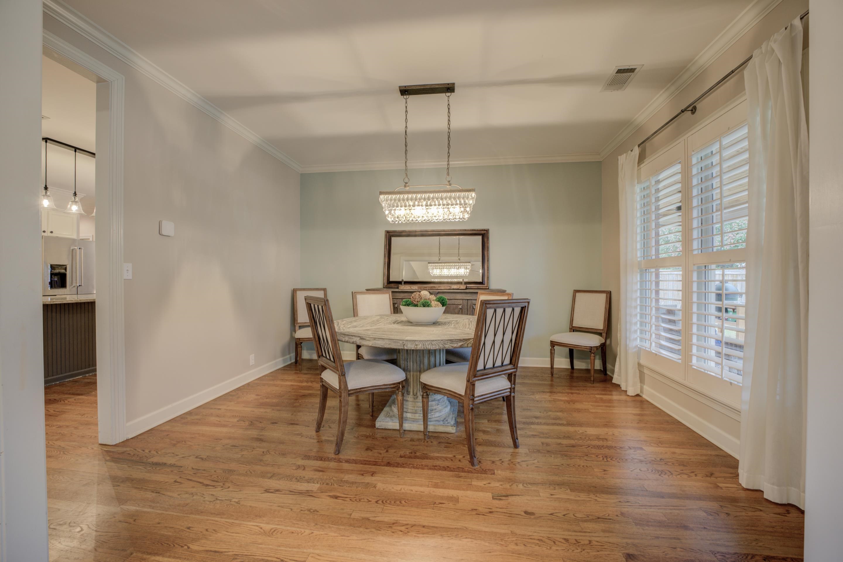 9852 Garden Place Collierville, TN 38139 - Photo 8 of 38 a view of a dining room with furniture window and wooden floor