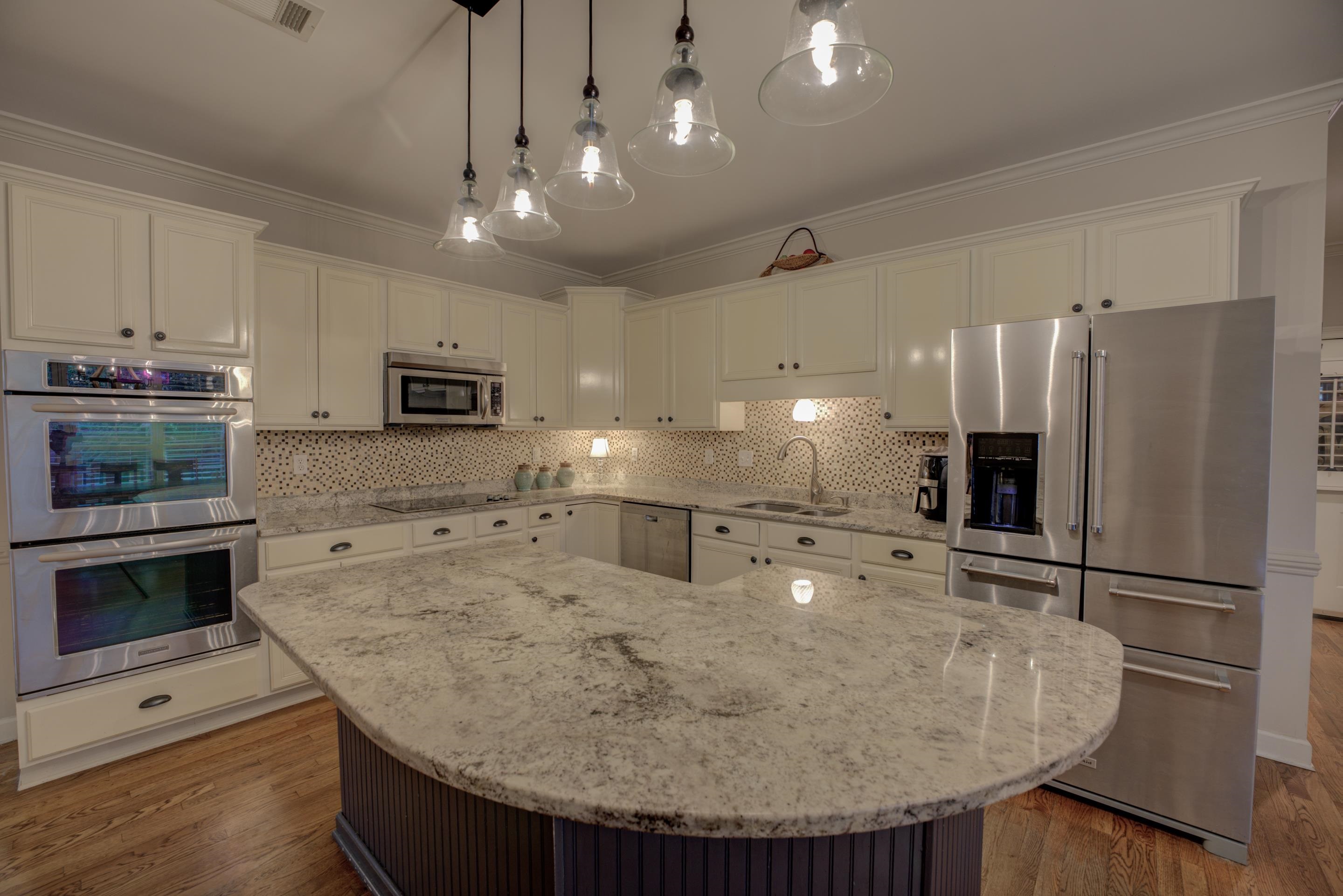 9852 Garden Place Collierville, TN 38139 - Photo 10 of 38 a kitchen with stainless steel appliances granite countertop a sink refrigerator and microwave