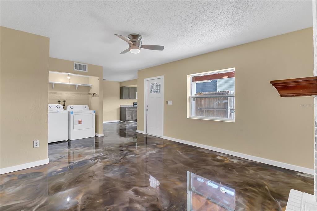 36 Springwood Square Port Orange, FL 32129 - Photo 13 of 31 a view of a big room with wooden floor and windows