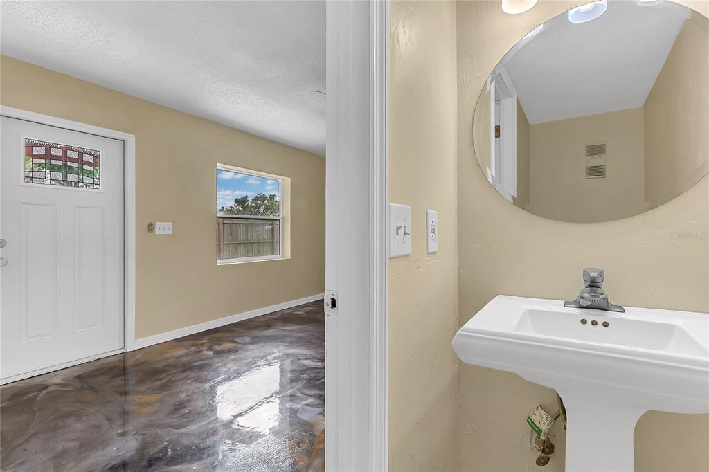 36 Springwood Square Port Orange, FL 32129 - Photo 14 of 31 a bathroom with a sink and mirror