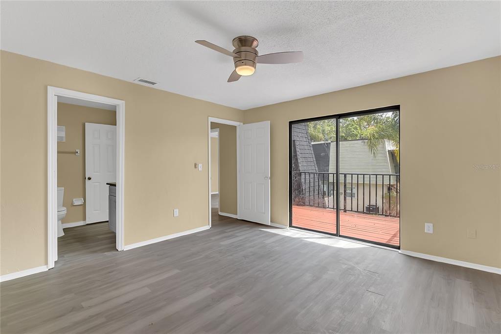 36 Springwood Square Port Orange, FL 32129 - Photo 17 of 31 a view of an empty room with a window and wooden floor