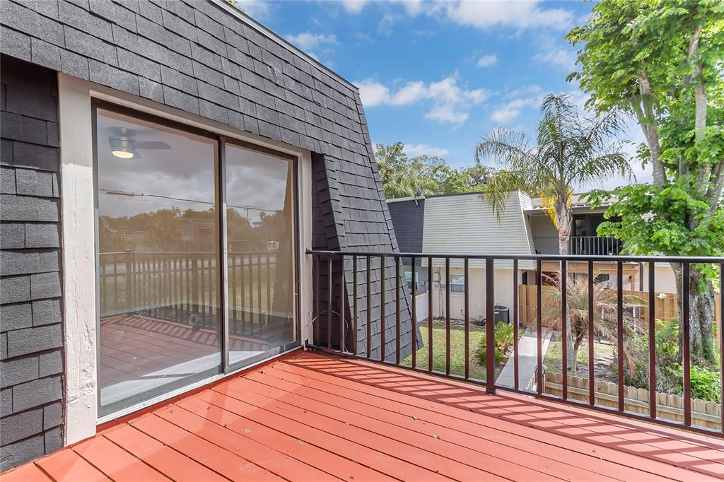 36 Springwood Square Port Orange, FL 32129 - Photo 23 of 31 a balcony with wooden floor