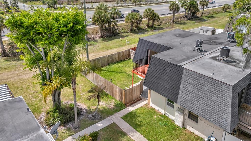 36 Springwood Square Port Orange, FL 32129 - Photo 27 of 31 a view of yard from deck having outdoor seating