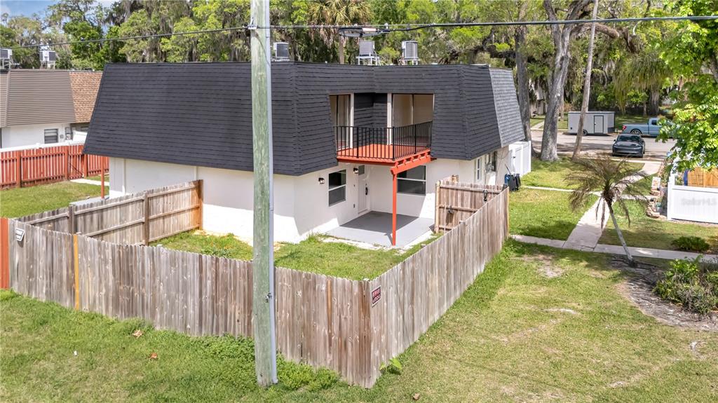 36 Springwood Square Port Orange, FL 32129 - Photo 30 of 31 a view of a house with backyard and sitting area
