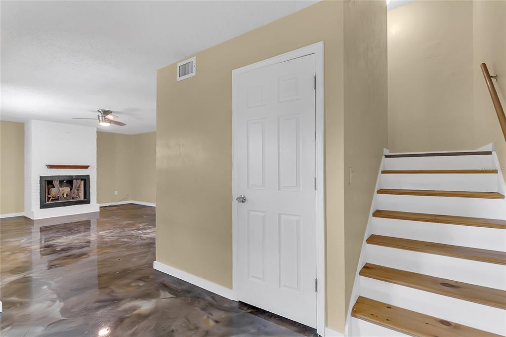 36 Springwood Square Port Orange, FL 32129 - Photo 10 of 31 a view of an entryway with staircase
