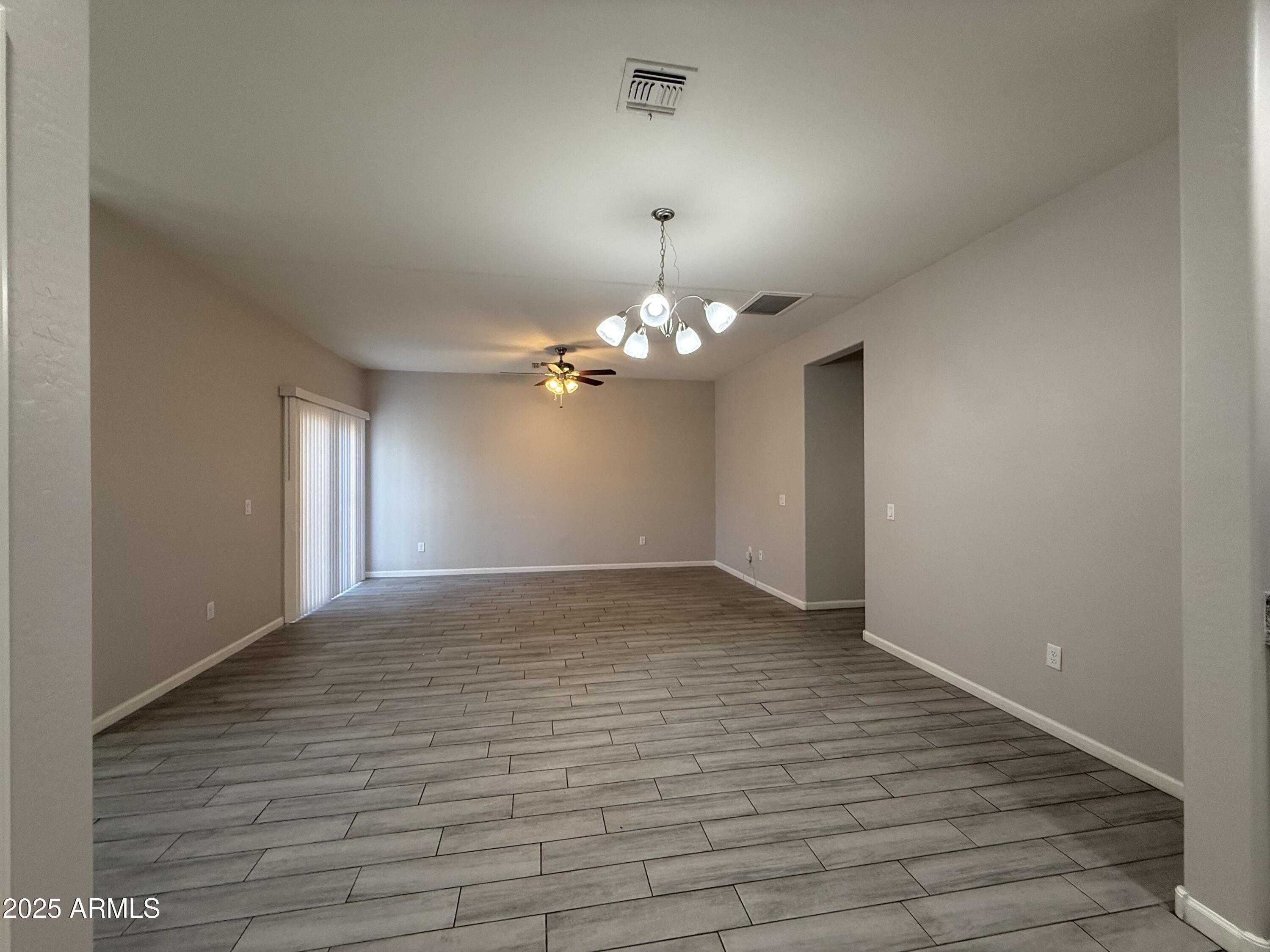 1743 West Pollack Street Phoenix, AZ 85041 - Photo 17 of 46 a view of empty room with wooden floor