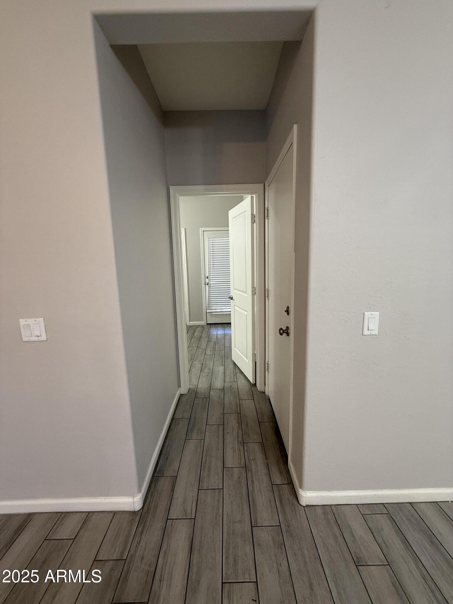 1743 West Pollack Street Phoenix, AZ 85041 - Photo 18 of 46 a view of a room with wooden floor