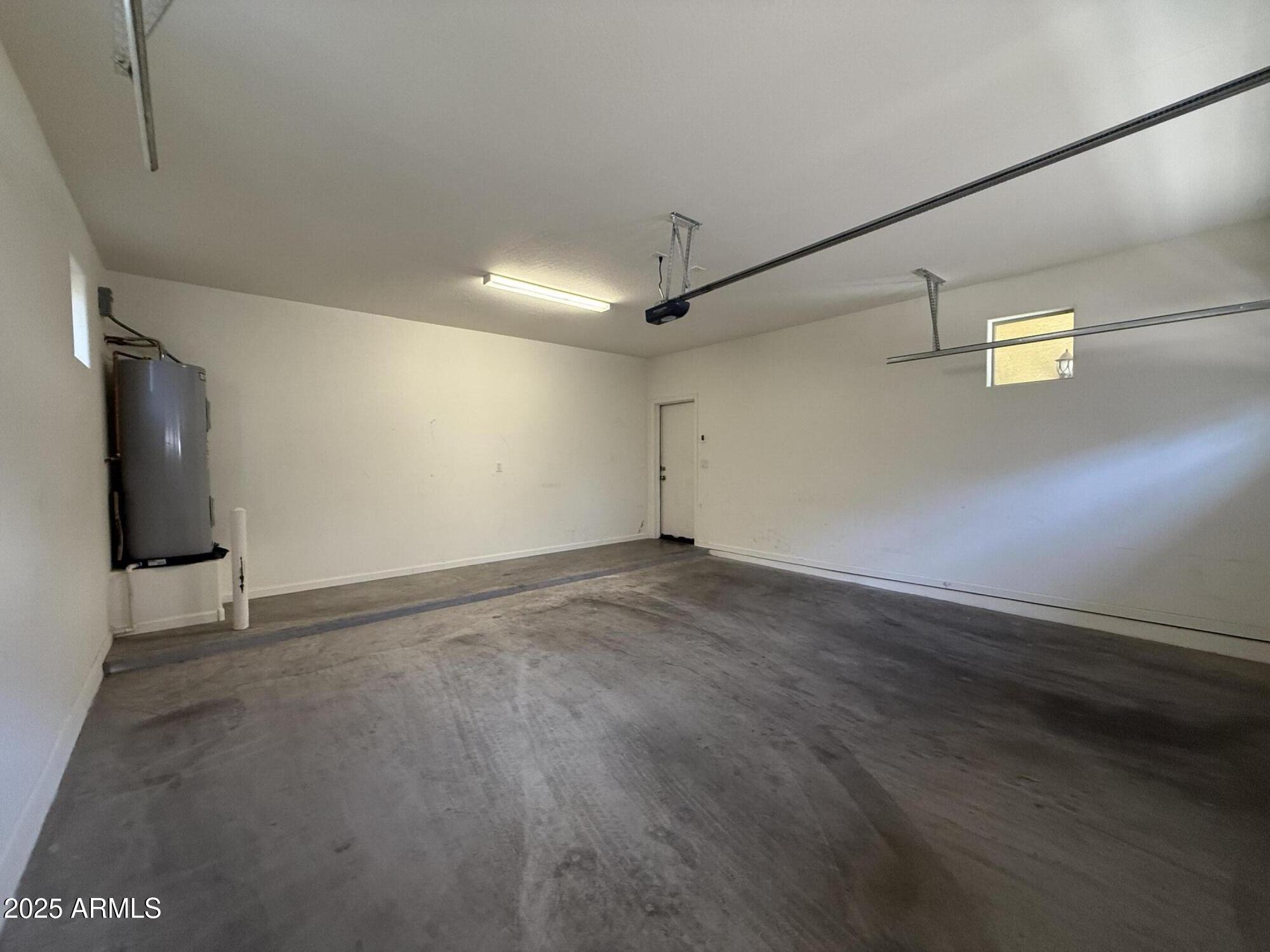 1743 West Pollack Street Phoenix, AZ 85041 - Photo 20 of 46 a view of a livingroom with wooden floor and a window