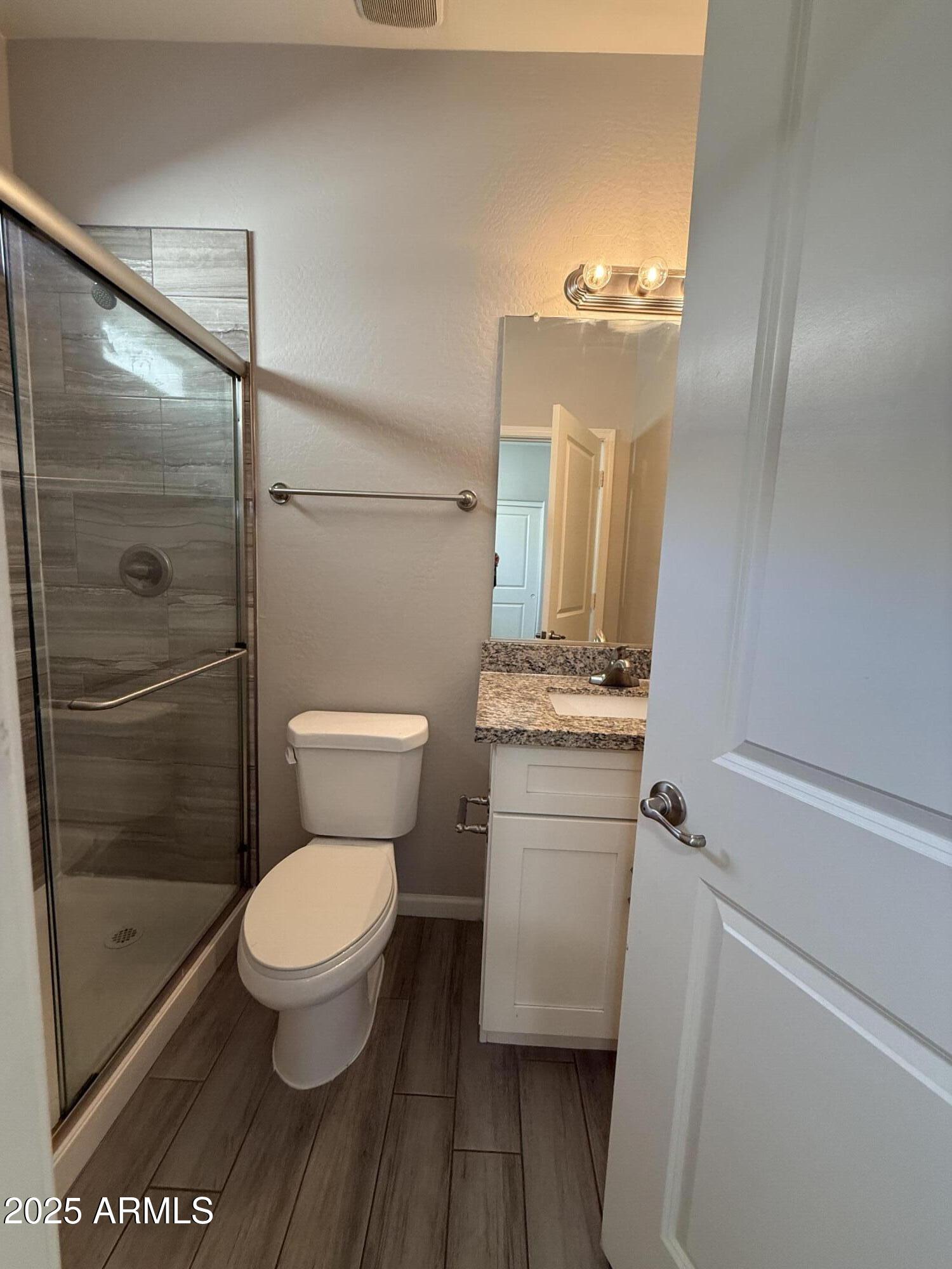 1743 West Pollack Street Phoenix, AZ 85041 - Photo 24 of 46 a bathroom with a toilet and a shower