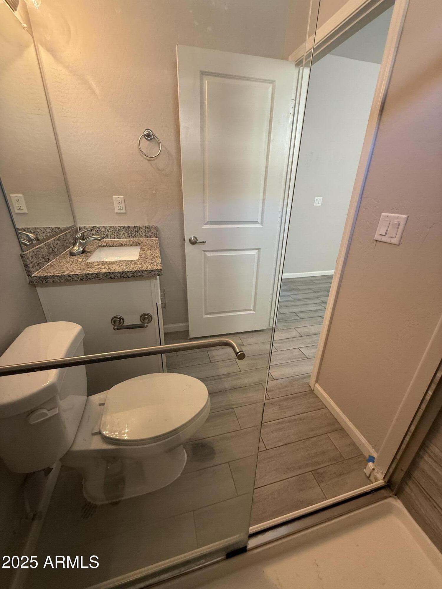 1743 West Pollack Street Phoenix, AZ 85041 - Photo 26 of 46 a bathroom with a sink and a mirror