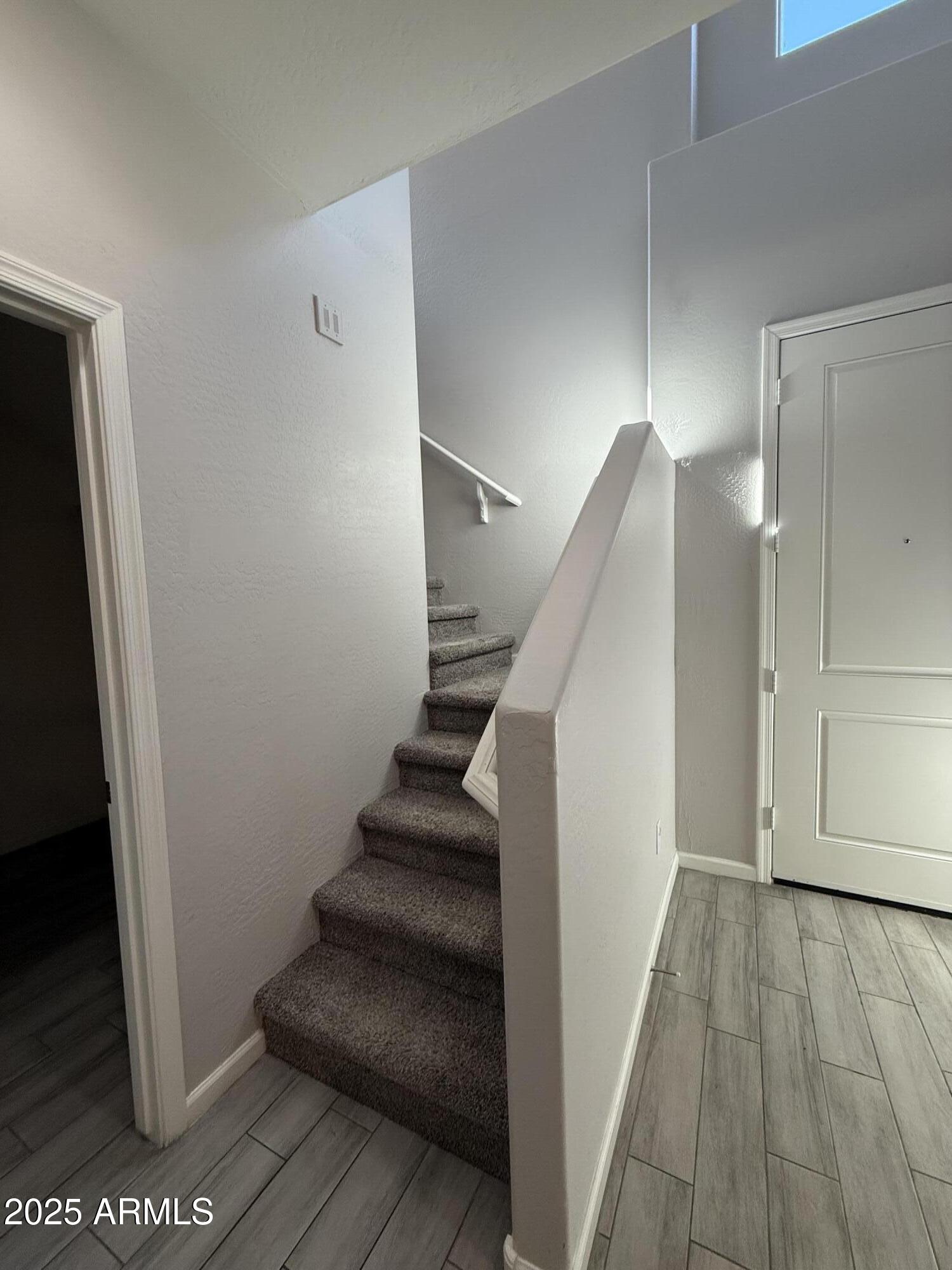 1743 West Pollack Street Phoenix, AZ 85041 - Photo 28 of 46 a view of entryway with wooden floor
