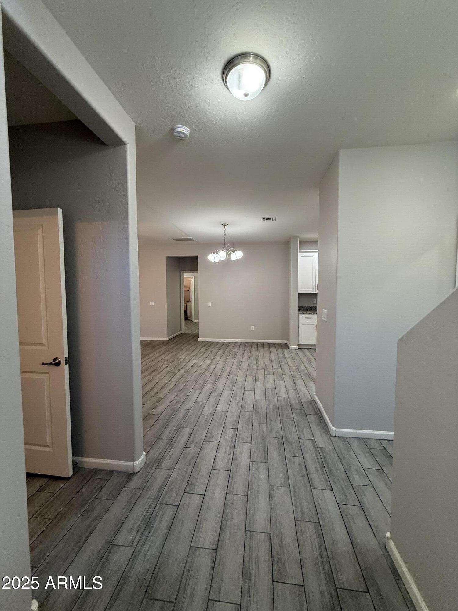 1743 West Pollack Street Phoenix, AZ 85041 - Photo 3 of 46 a view of a room with wooden floor
