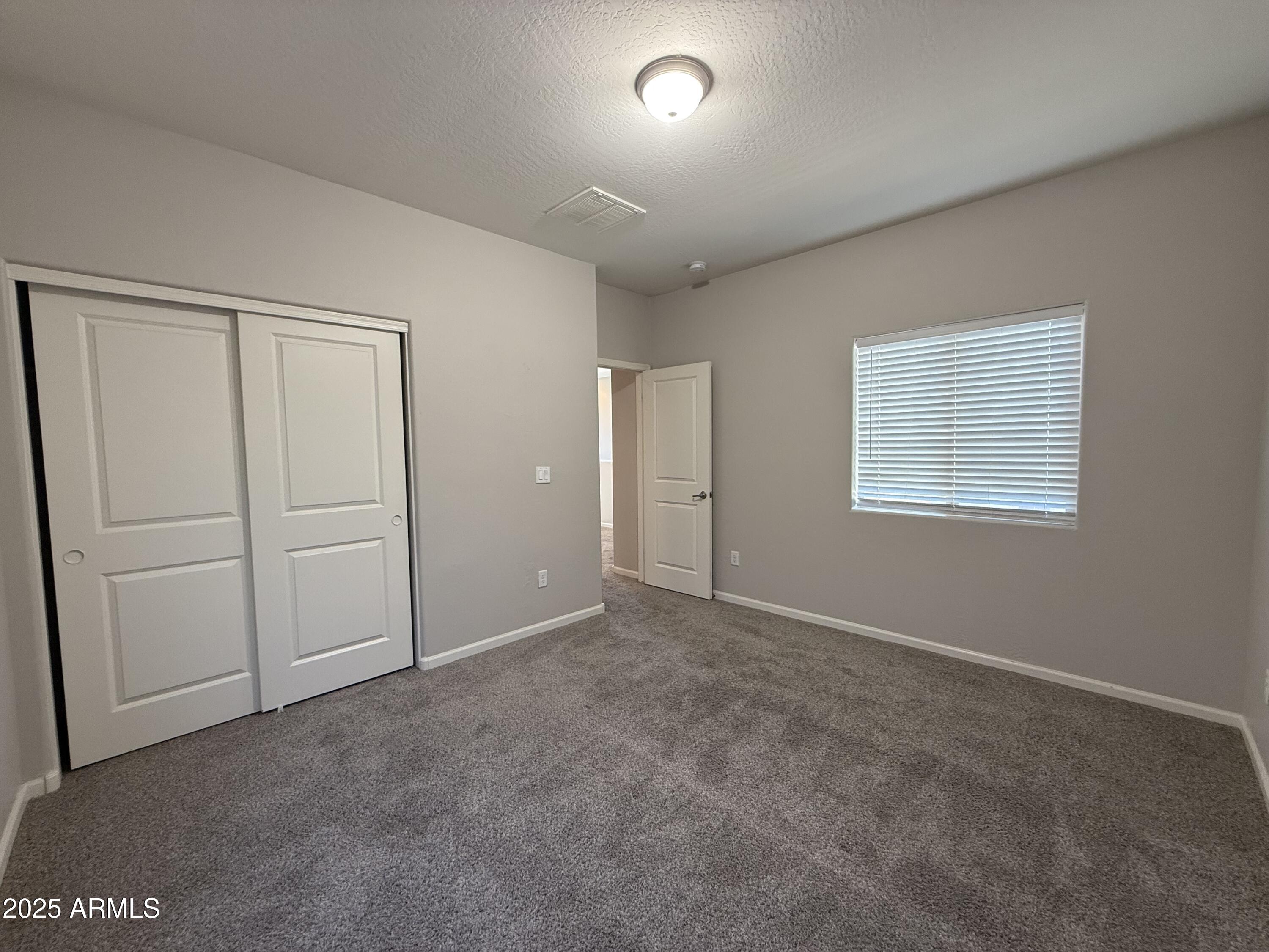 1743 West Pollack Street Phoenix, AZ 85041 - Photo 36 of 46 an empty room with closet area